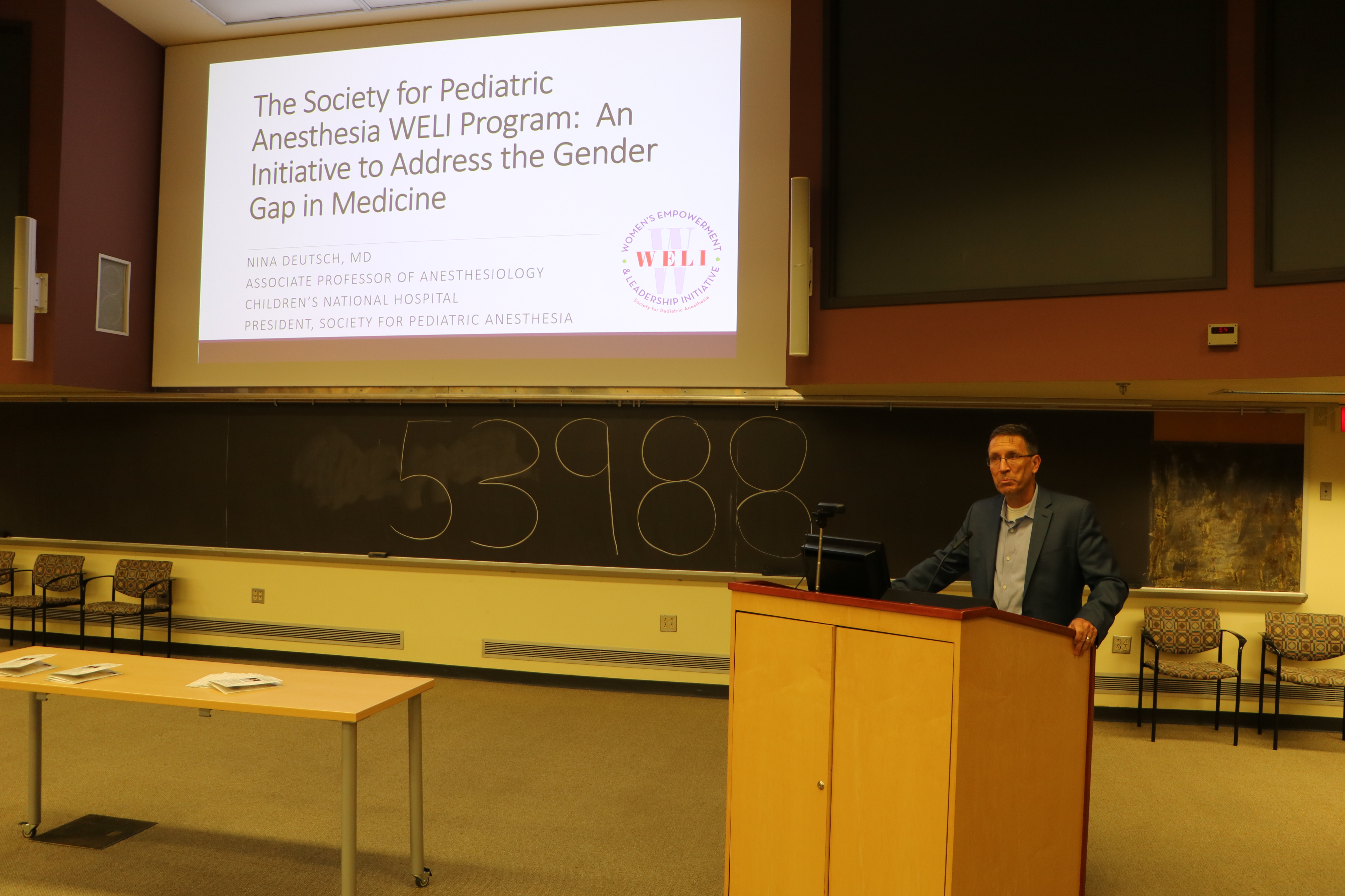 a man standing in front of a podium