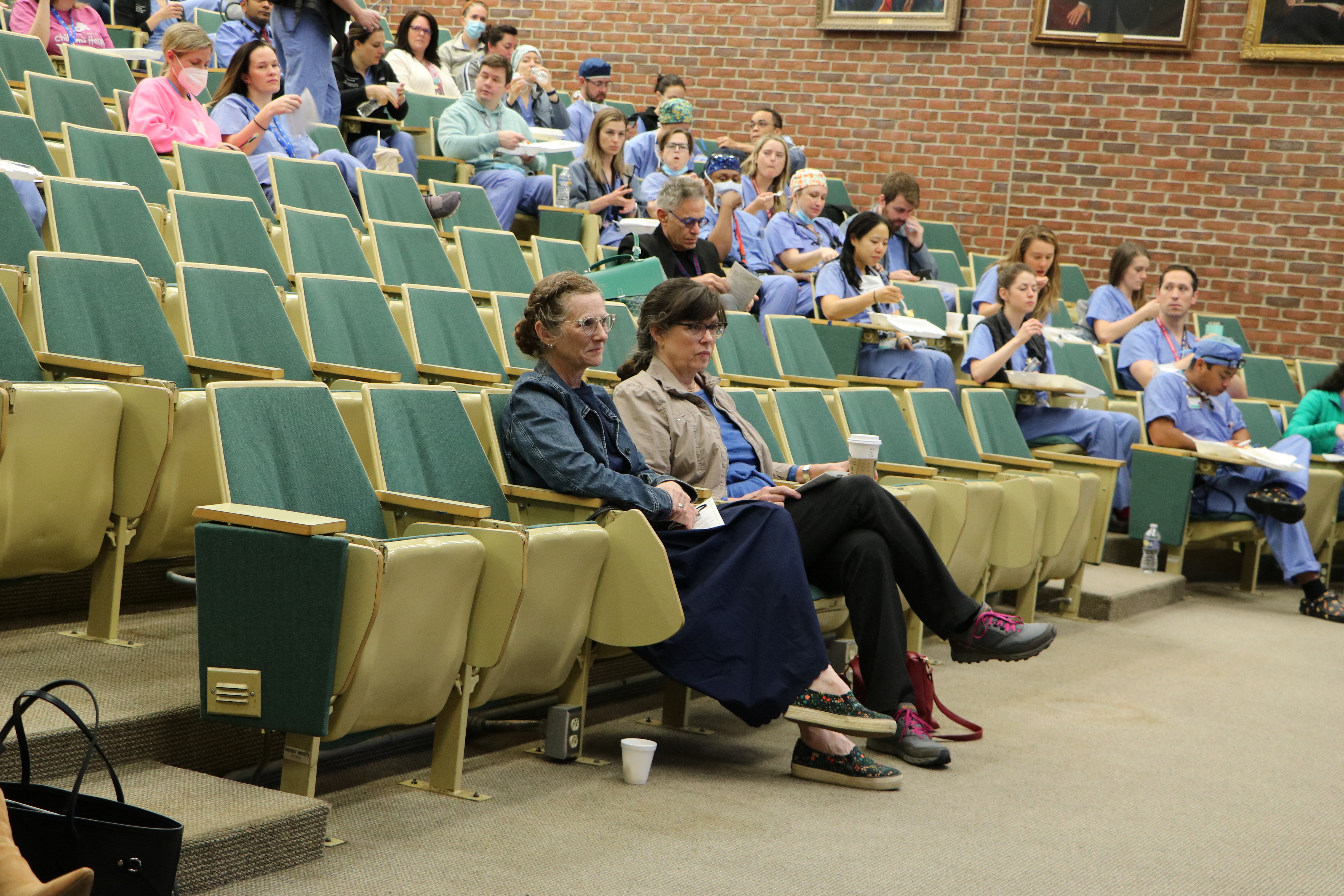 people sitting an auditorium