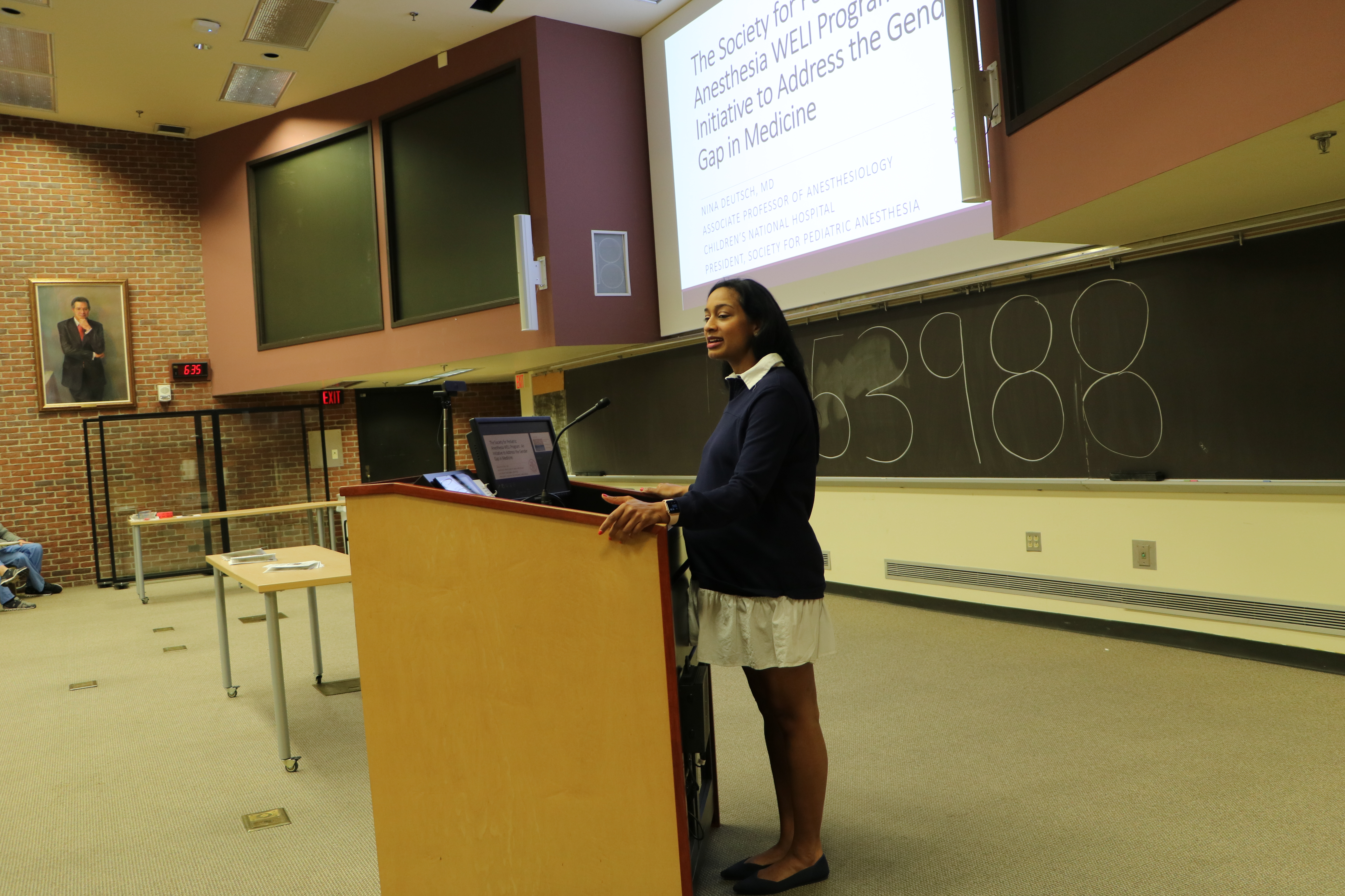 woman standing in front of a podium