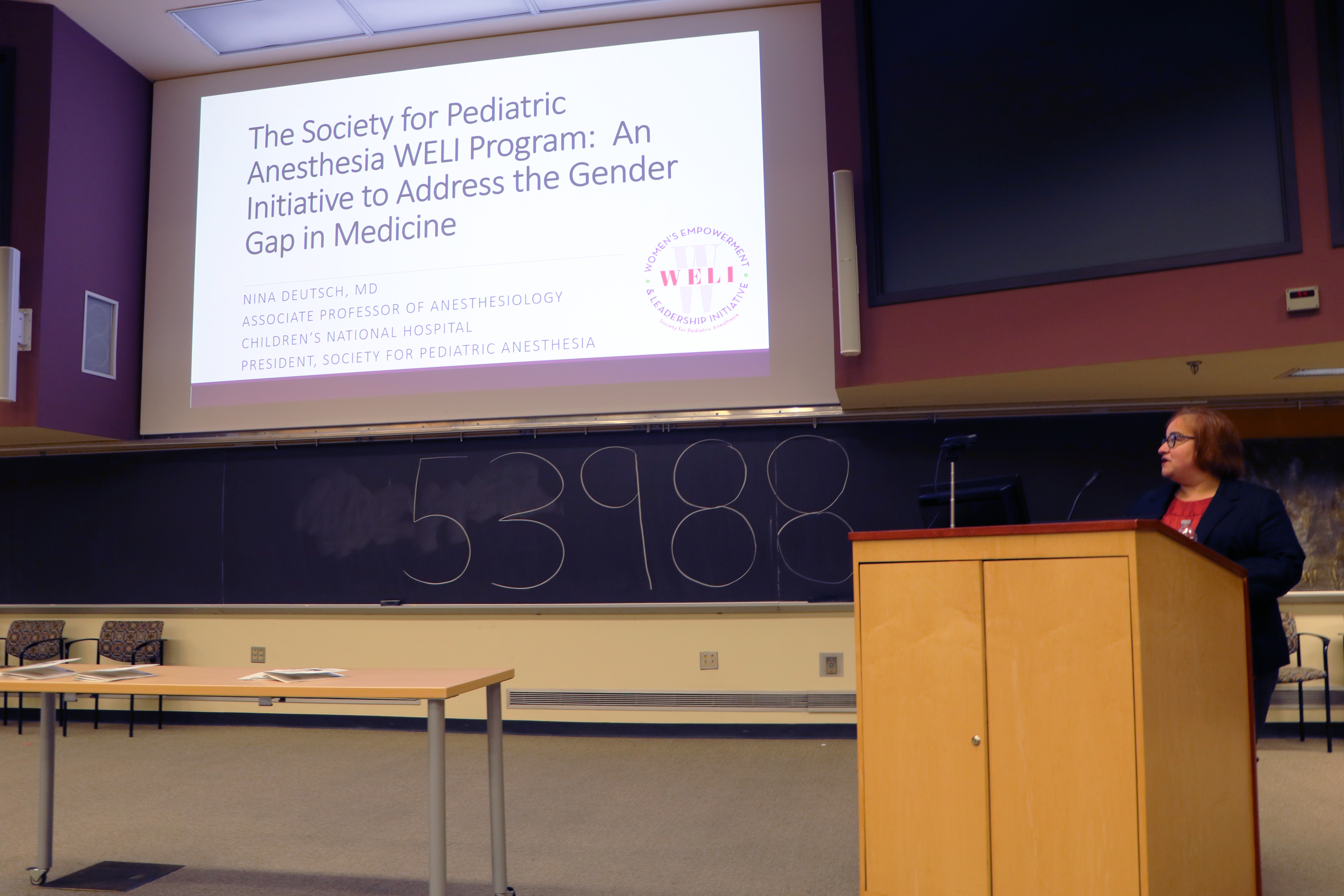 woman standing in front of a podium